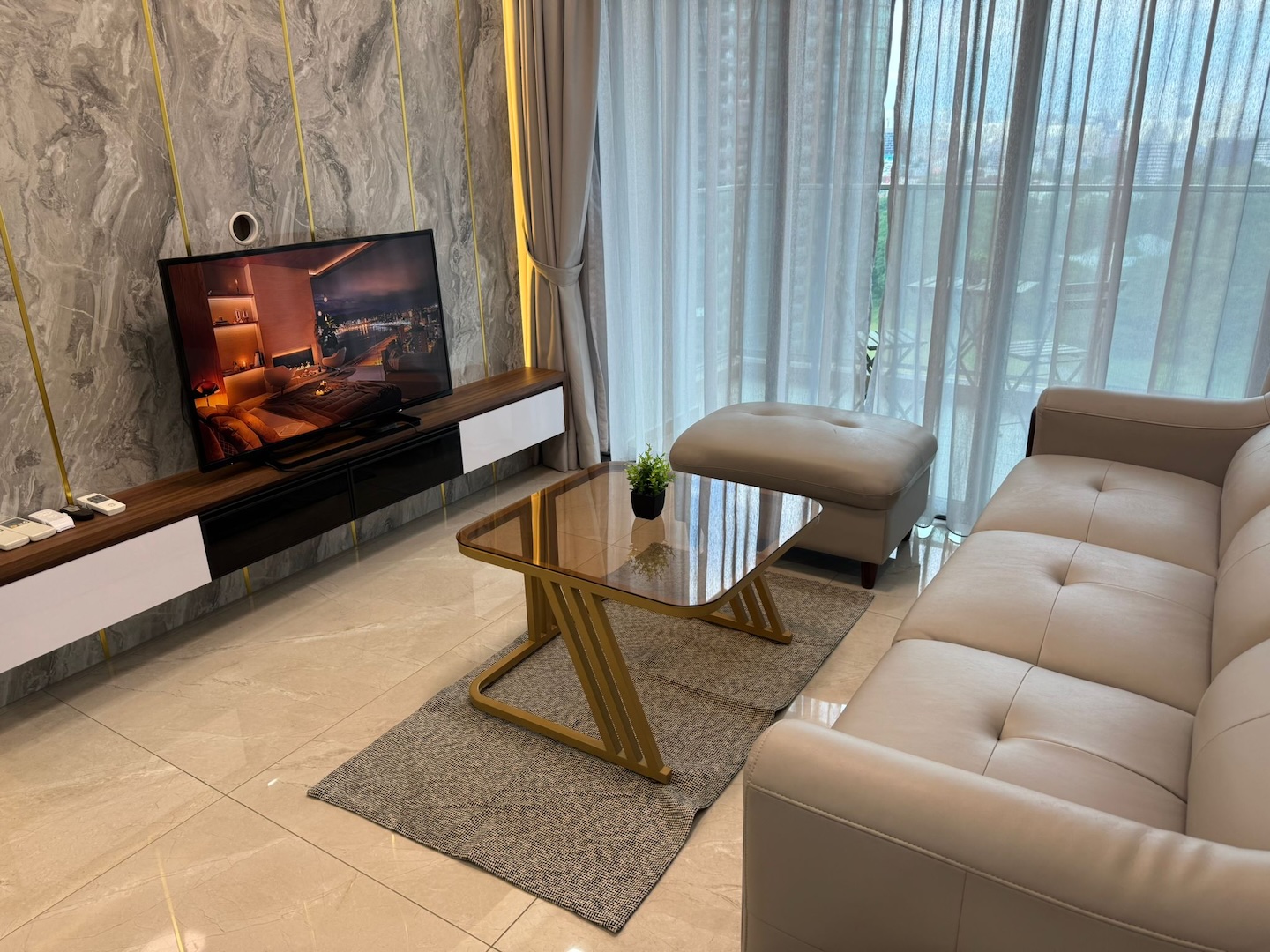 The living room of a residence at Normanton Park — room for a family or a team to share.